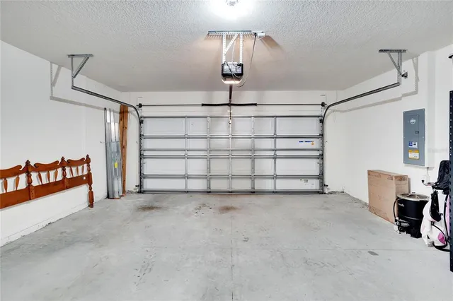 an aerial view of a house with a swimming pool yard and outdoor seating