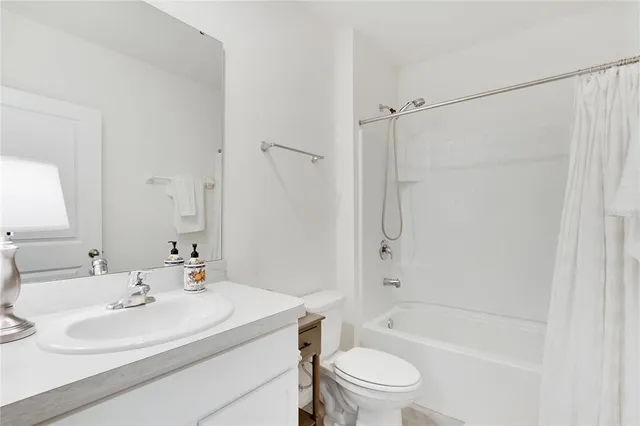 a bed room with a bed and a lamp