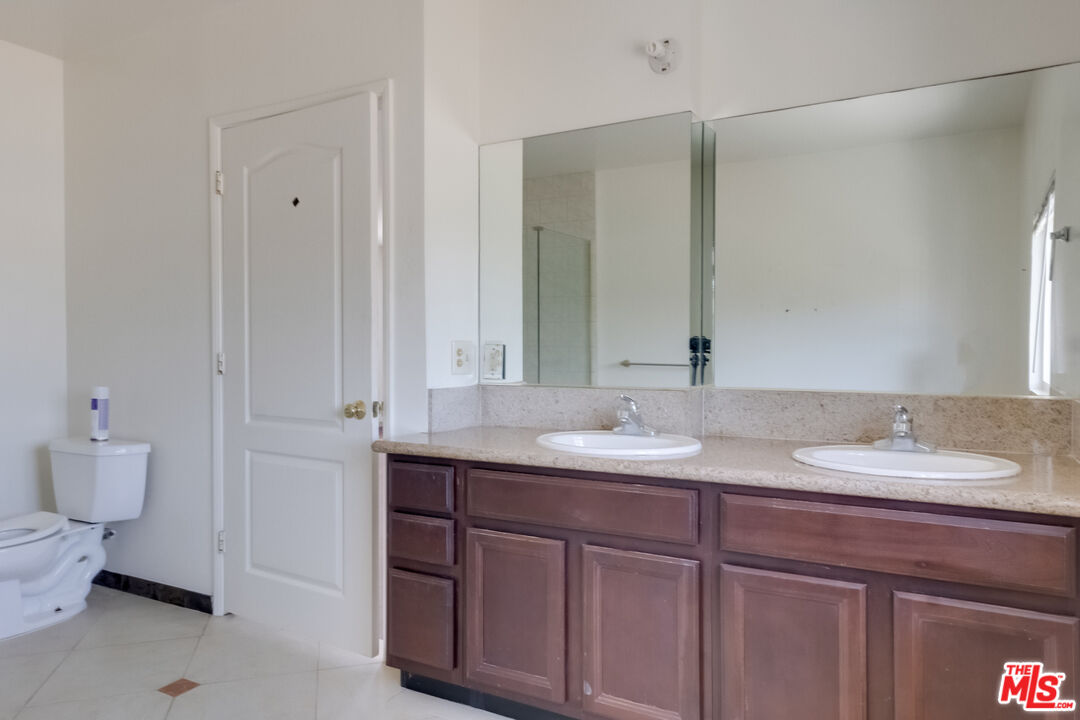 4336 Alla Road Los Angeles, CA 90066 - Photo 22 of 54 a bathroom with a double vanity sink and a mirror