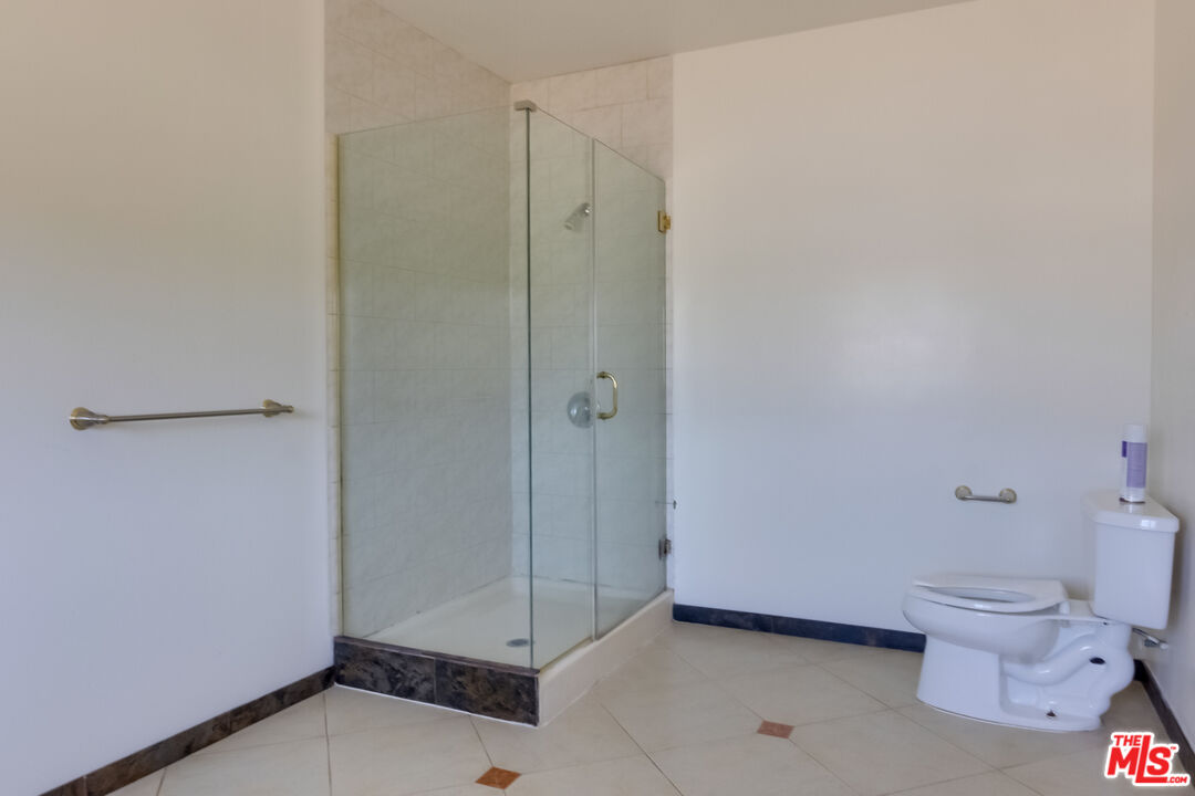 4336 Alla Road Los Angeles, CA 90066 - Photo 23 of 54 a bathroom with a toilet and a shower