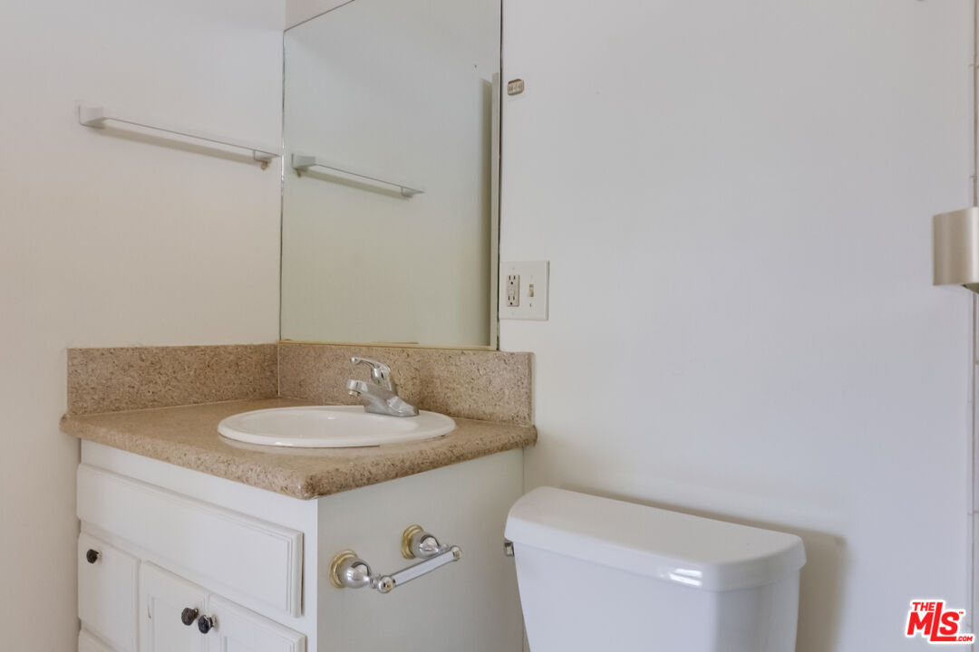 4336 Alla Road Los Angeles, CA 90066 - Photo 40 of 54 a bathroom with a granite countertop sink and a mirror