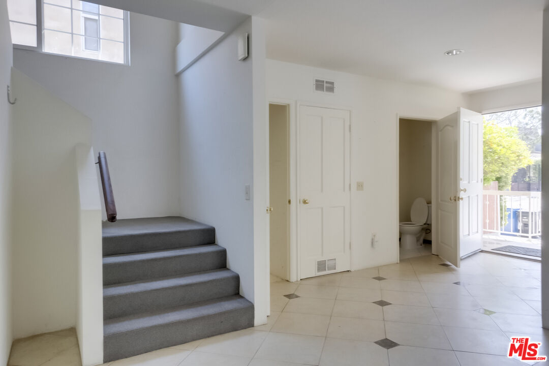 4336 Alla Road Los Angeles, CA 90066 - Photo 6 of 54 a view of an entryway with wooden floor and windows