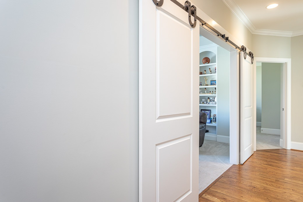 4604 Pleasant Pointe Way Raleigh, NC 27613 - Photo 19 of 30 Second floor hallway with custom built in shelves and site finished hardwoods Hallway