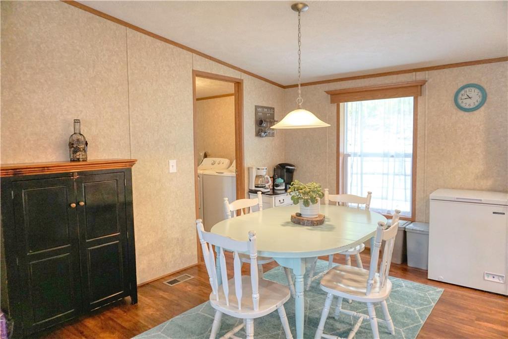 218 Rustic Ridge Lane Butler, PA 16002 - Photo 11 of 19 a view of a dining room with furniture window and wooden floor