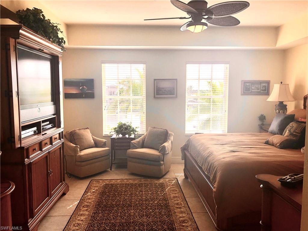 451 Bayfront Place, Unit 5311 Naples, FL 34102 - Photo 26 of 38 a bedroom with a bed couch and window