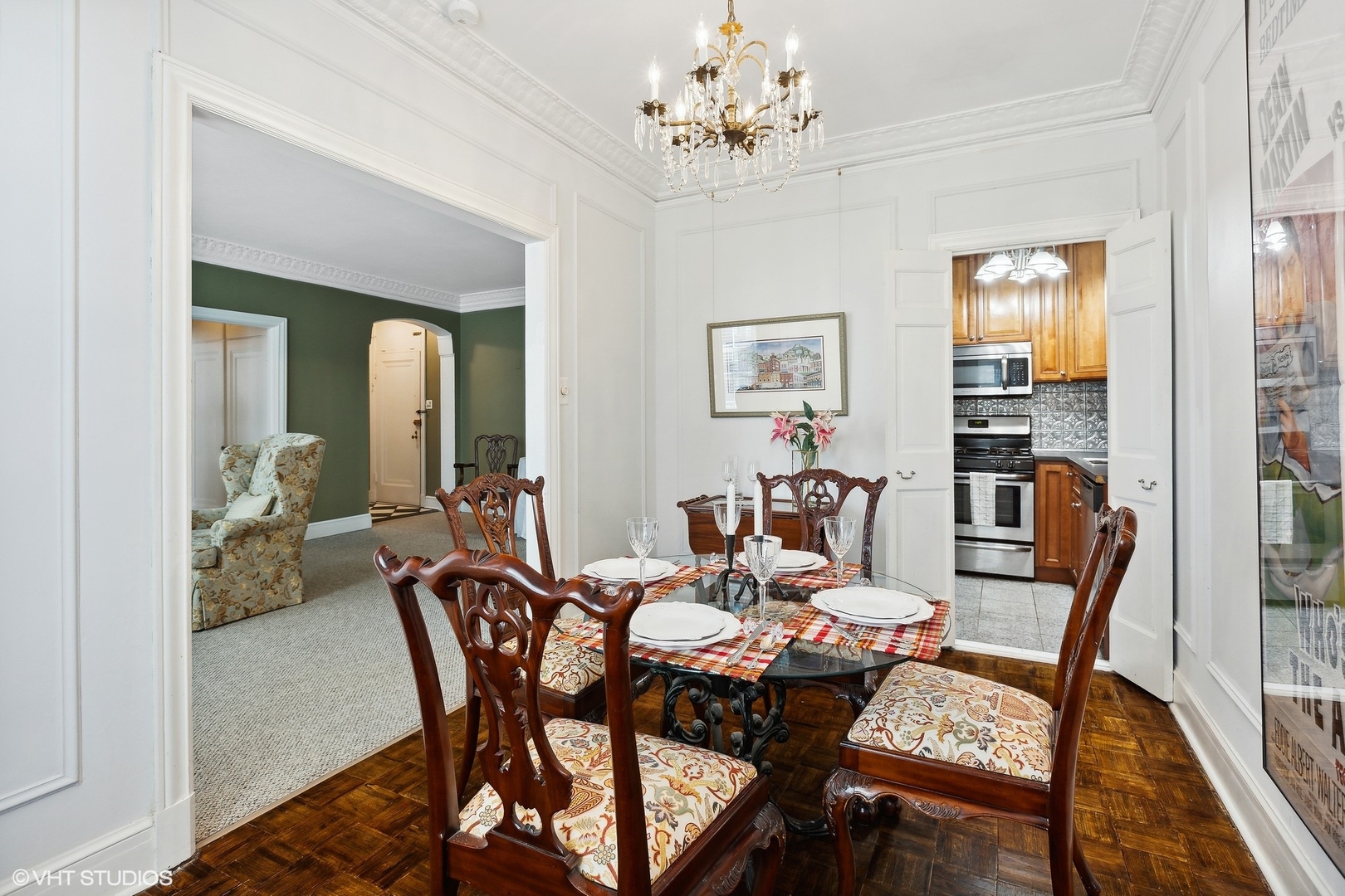 6101 North Sheridan Road, Unit 9D Chicago, IL 60660 - Photo 14 of 22 a view of a dining room with furniture wooden floor and a chandelier