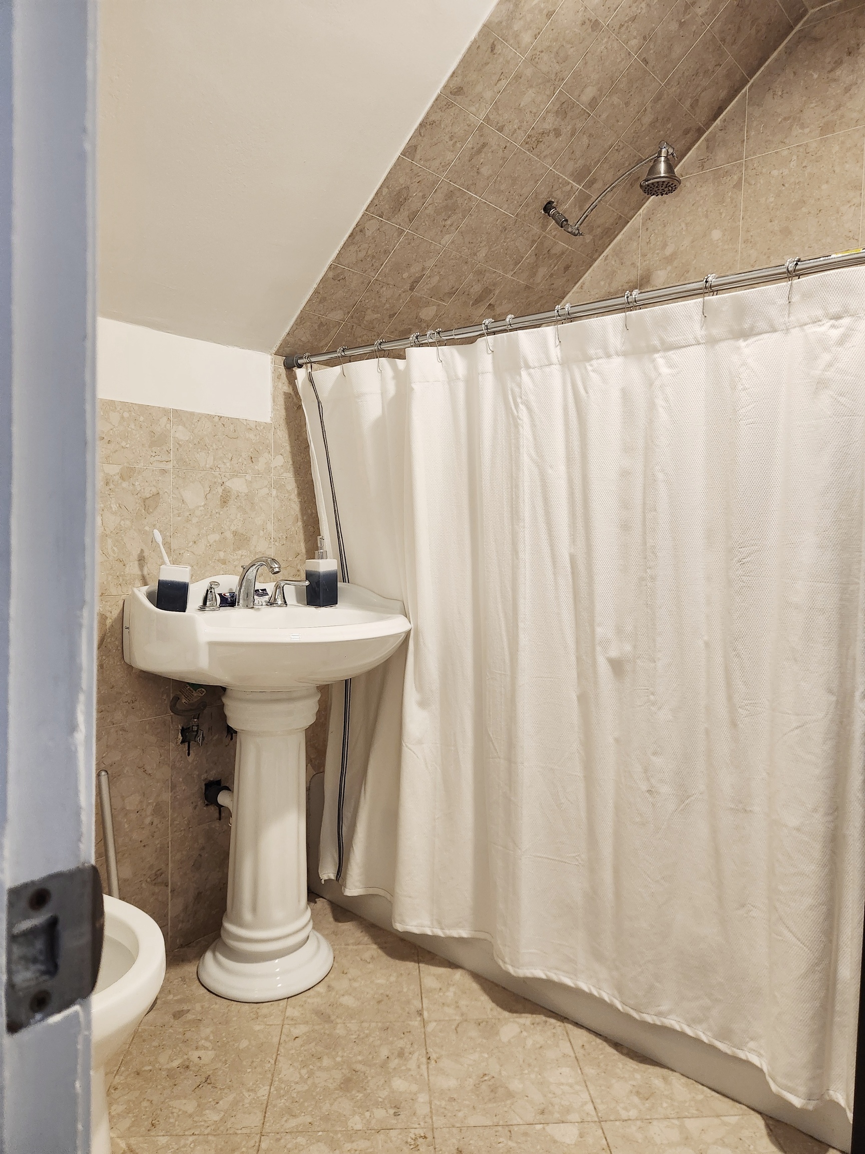 61 Aberdeen Street Stamford, CT 06902 - Photo 12 of 19 a bathroom with a sink a mirror and a shower