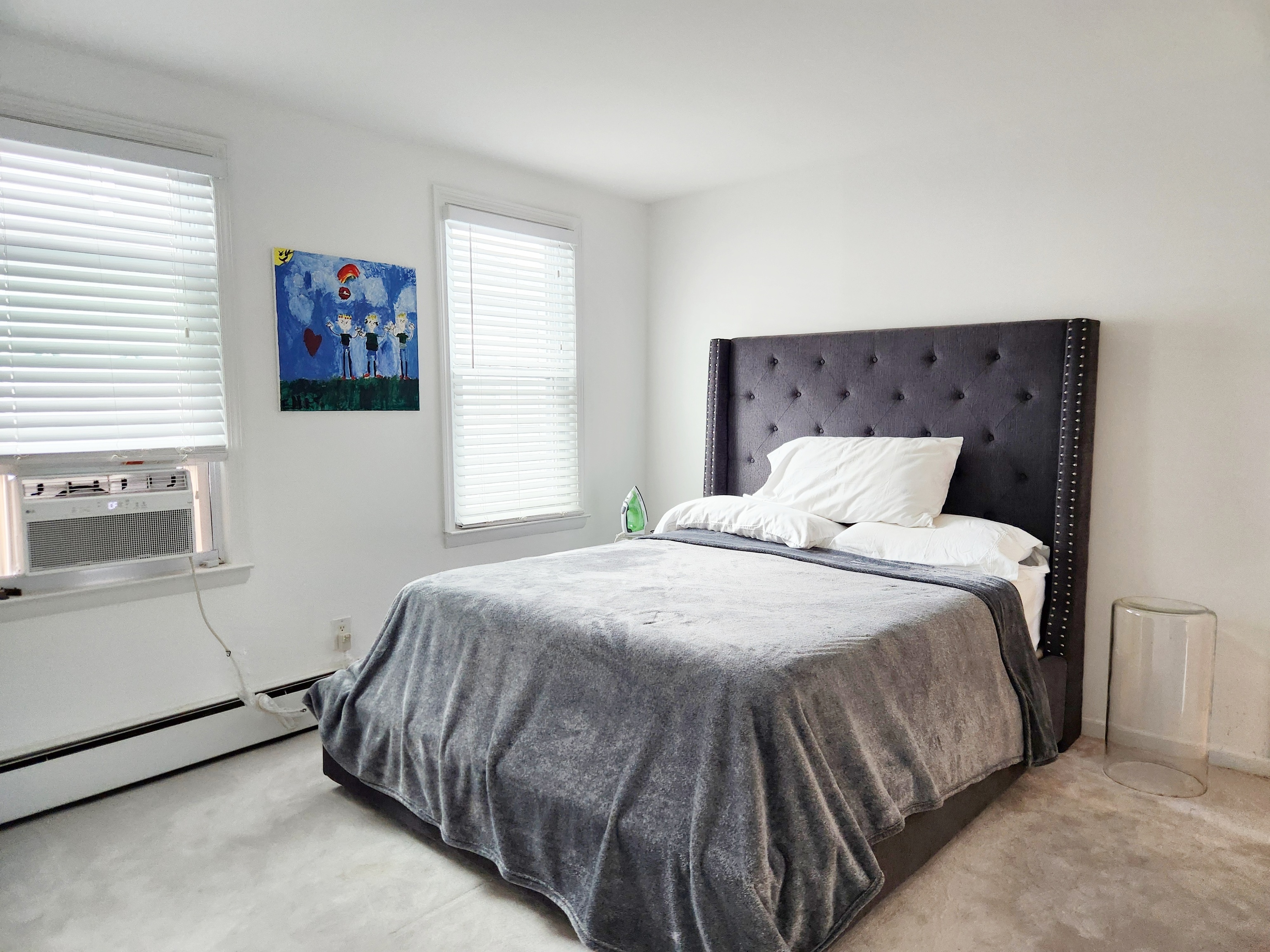 61 Aberdeen Street Stamford, CT 06902 - Photo 13 of 19 a bedroom with a bed and painting on the wall