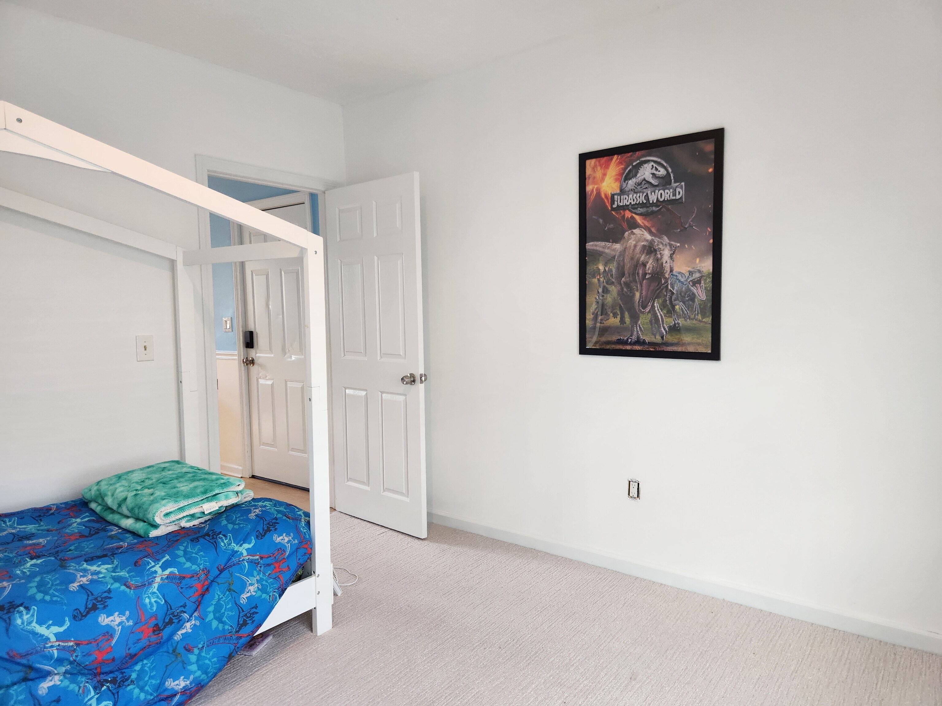 61 Aberdeen Street Stamford, CT 06902 - Photo 18 of 19 a spacious bedroom with a bed and a painting on the wall