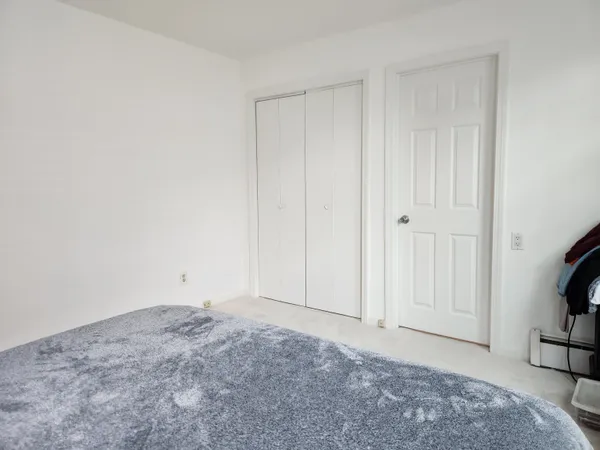a view of an empty room and bedroom