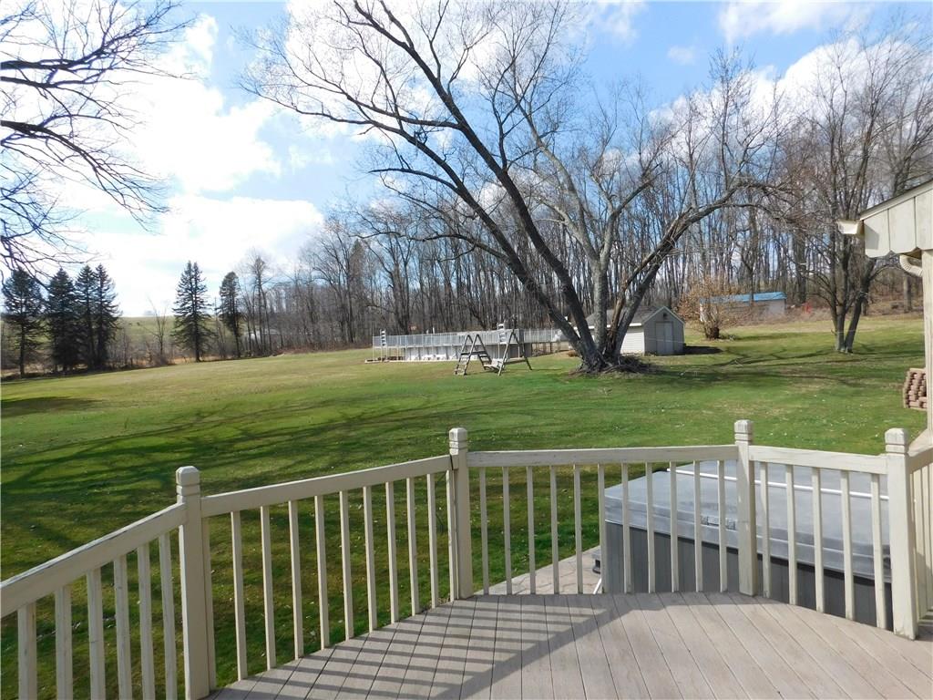 105 Spohn Road Freeport, PA 16229 - Photo 23 of 25 Fabulous 40' covered back deck with a bump out sun porch overlooking rolling grounds, your own personal hot tub and magnificent pool.