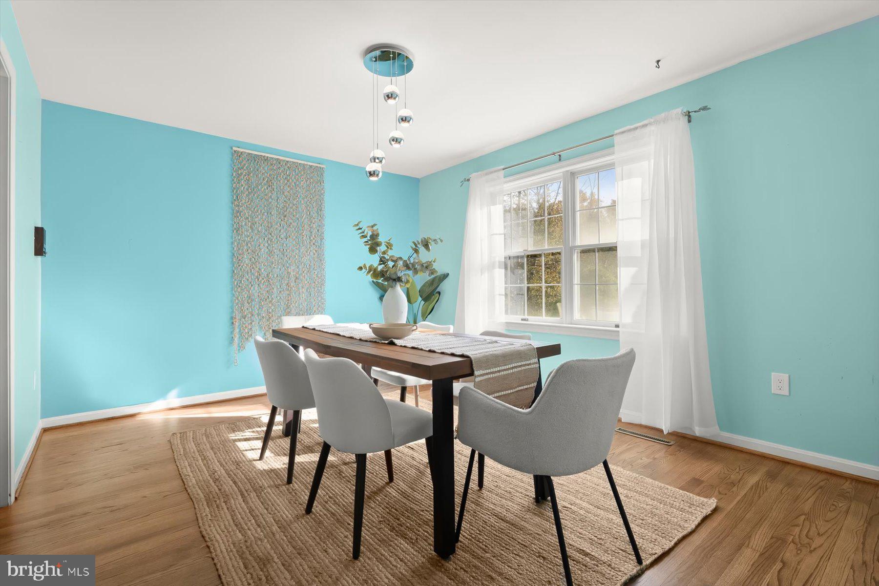 9600 Watkins Road Gaithersburg, MD 20882 - Photo 11 of 48 a view of a dining room with furniture window and wooden floor