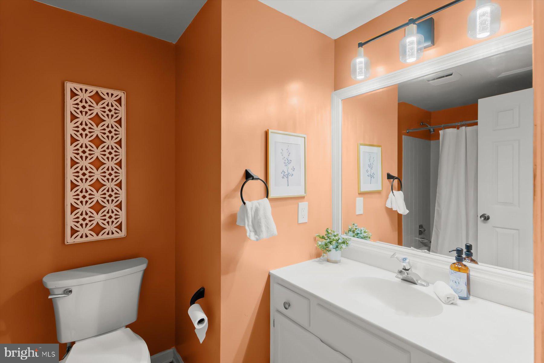 9600 Watkins Road Gaithersburg, MD 20882 - Photo 24 of 48 a bathroom with a toilet sink and mirror