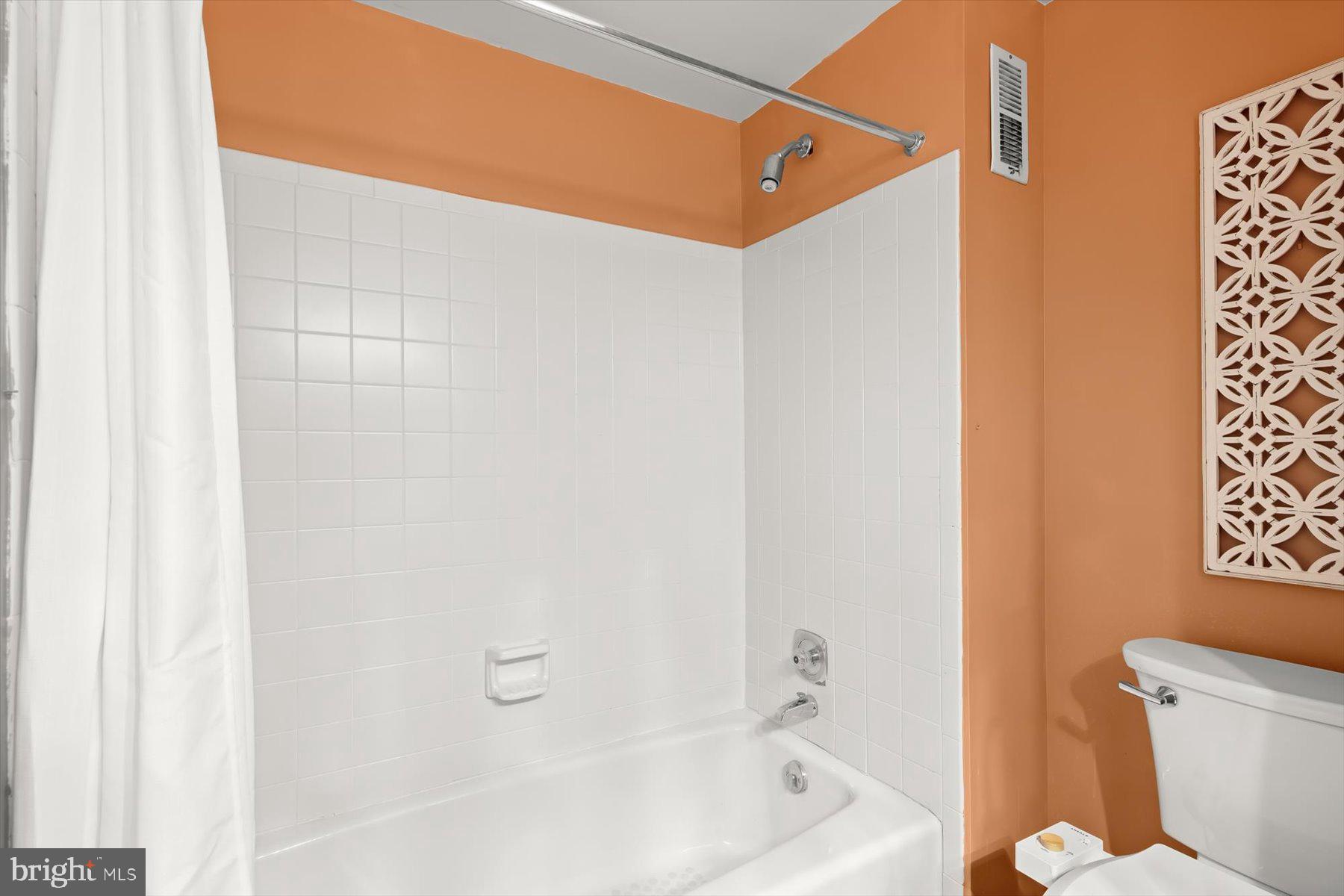 9600 Watkins Road Gaithersburg, MD 20882 - Photo 25 of 48 a bathroom with a bathtub and shower