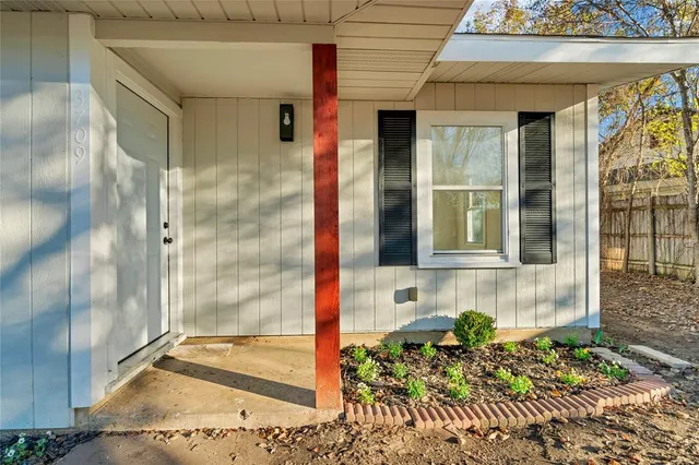 a front view of a house with a glass door