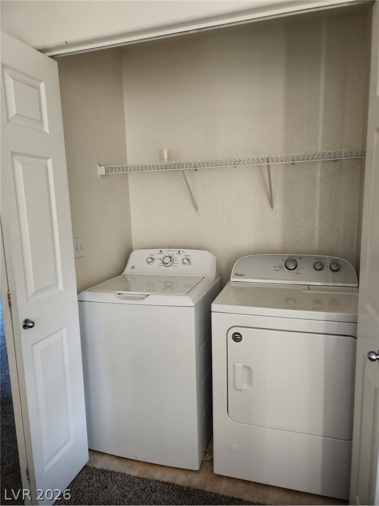 11901 Fairfax Ridge Street Las Vegas, NV 89183 - Photo 38 of 46 Laundry area featuring independent washer and dryer and tile patterned flooring