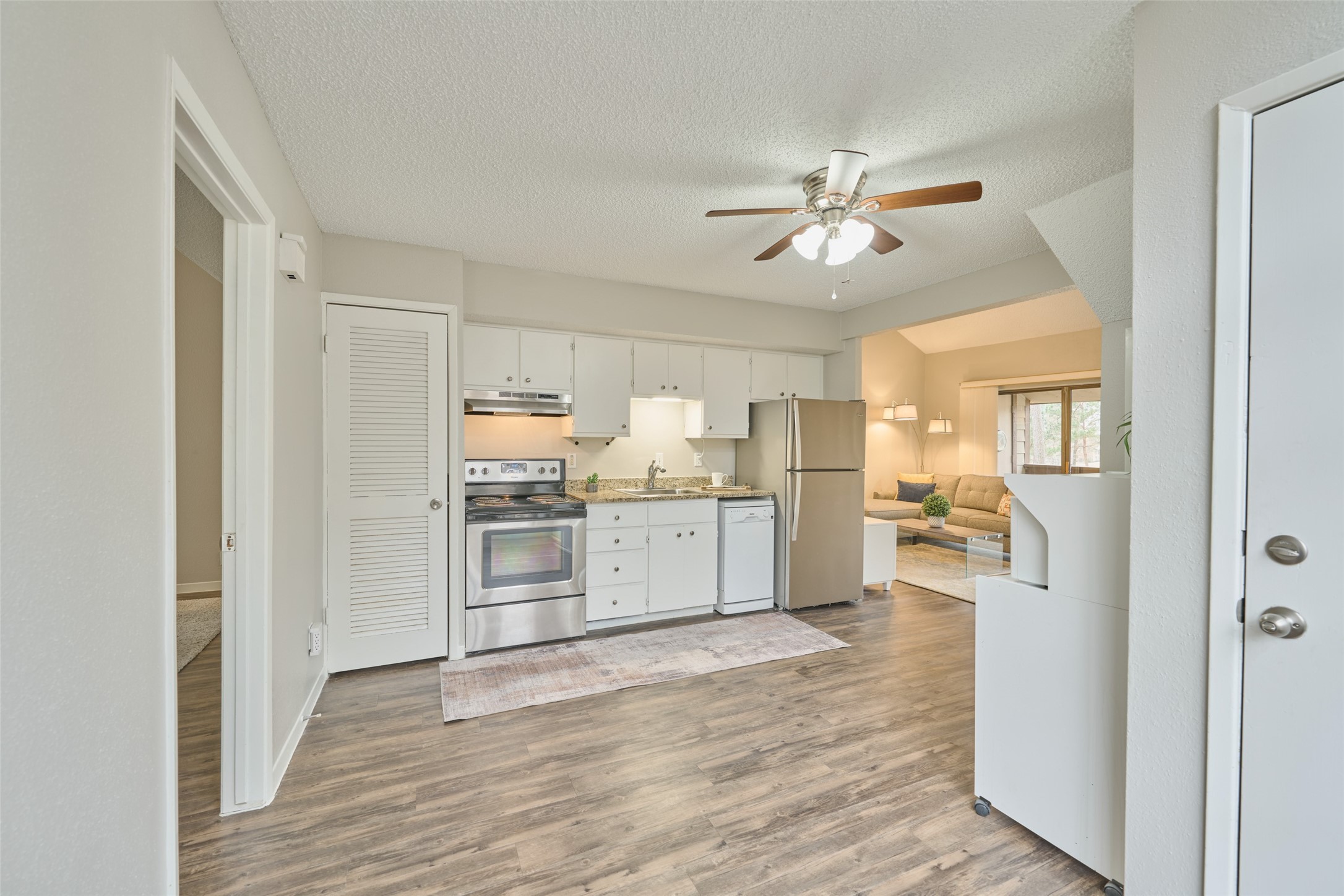 12900 Walden Road, Unit 602F Montgomery, TX 77356 - Photo 26 of 26 Spacious 2 bedroom, 2 bath condo - you will love this floor plan. Entire interior painted January 2025. Granite counters in kitchen & bathrooms have been updated too. Stainless range, microwave & refrigerator. All dishes, utensils, bed in primary bedroom, 2 lamps, living room couch, tv stand, standing lamp & coffer table will all remain & are included in the sale.