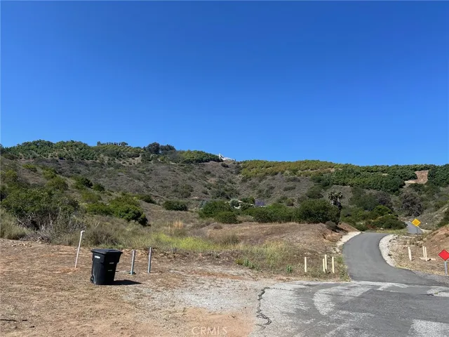 a view of a dry yard with mountain