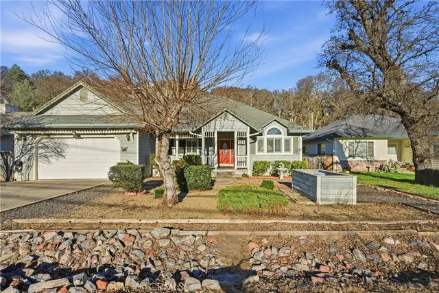 a front view of a house with garden