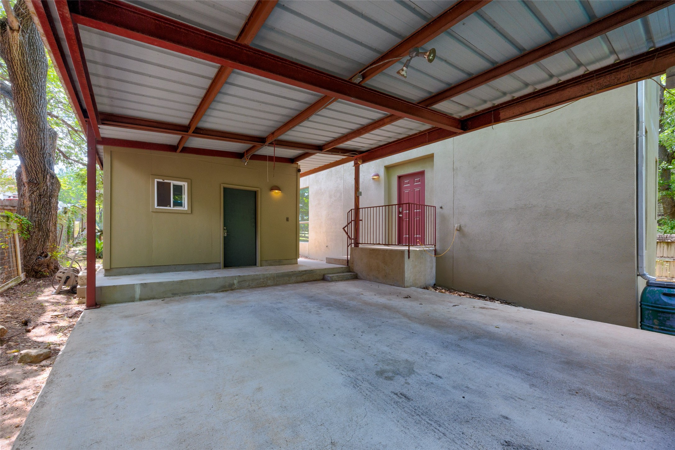 1305 Chestnut Avenue Austin, TX 78702 - Photo 32 of 40 A spacious covered parking area provides convenient shelter for vehicles and easy access to the property's entrances.