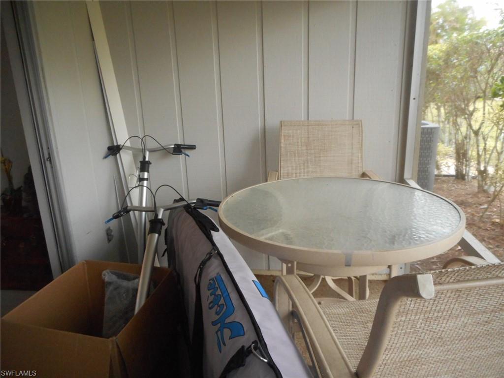 1007 Pine Isle Lane, Unit 1007 Naples, FL 34112 - Photo 17 of 22 a bathroom with a sink
