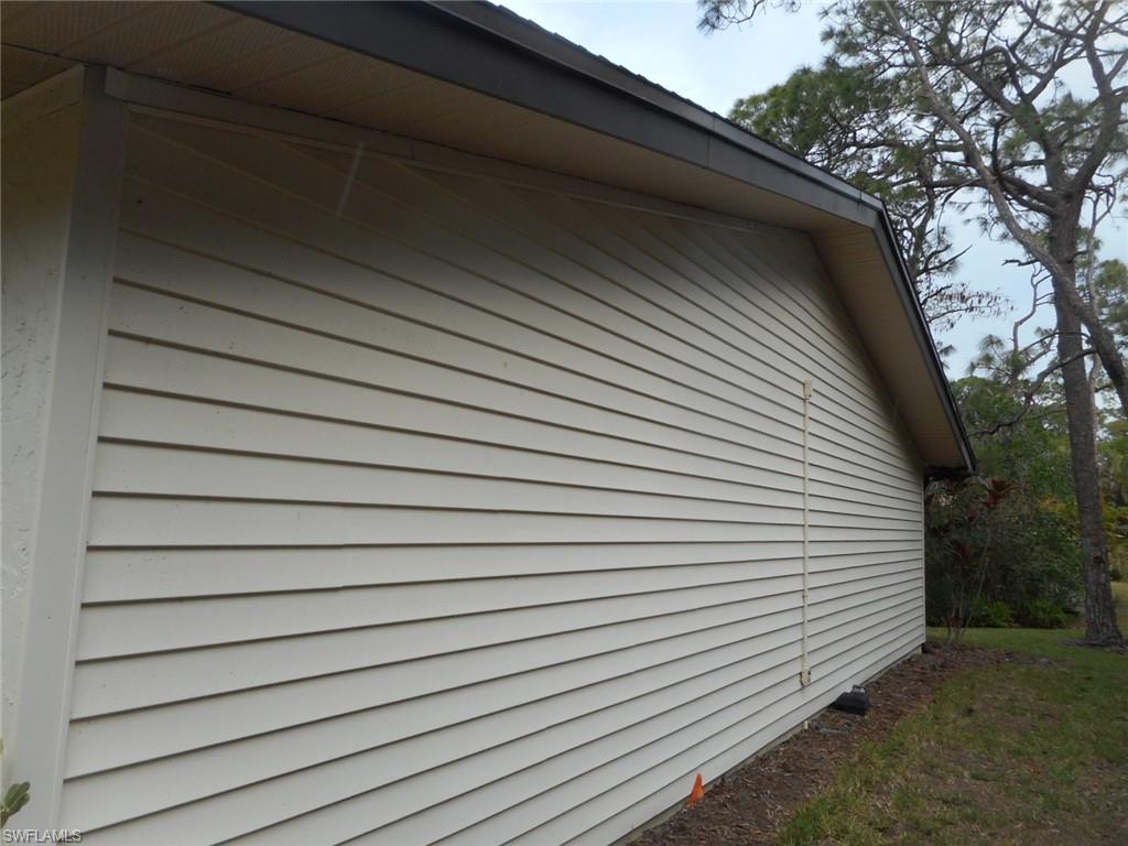 1007 Pine Isle Lane, Unit 1007 Naples, FL 34112 - Photo 22 of 22 a view of a house with a roof