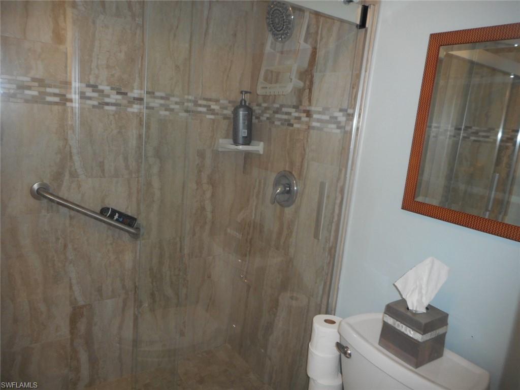 1007 Pine Isle Lane, Unit 1007 Naples, FL 34112 - Photo 9 of 22 a bathroom with a shower