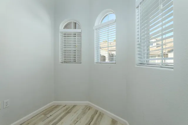 a view of empty room with windows