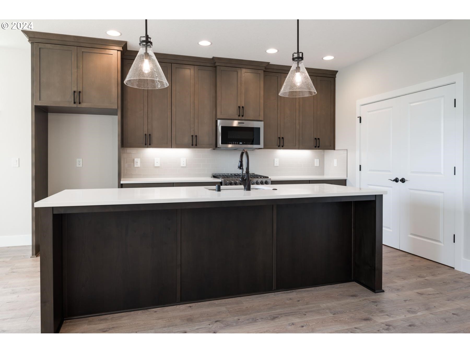 705 Northeast 174th Street Ridgefield, WA 98642 - Photo 8 of 13 a kitchen with a sink and cabinets