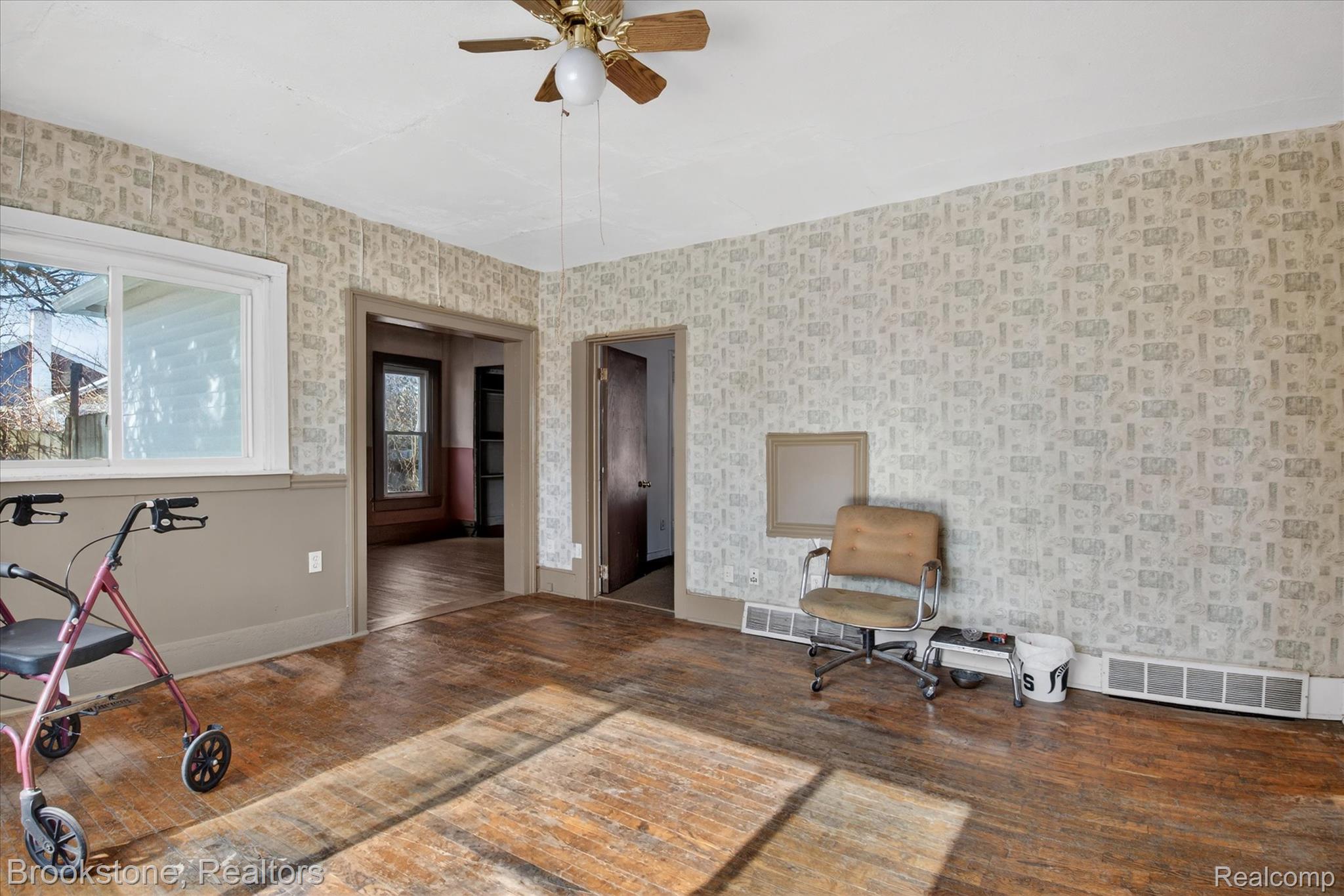 6756 West Beard Road Perry, MI 48872 - Photo 18 of 32 Unfurnished room with a ceiling fan and wood finished floors