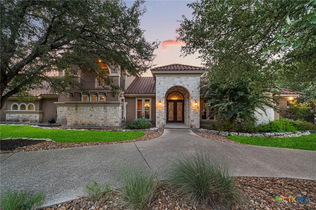 7607 Sky Loop Garden Ridge, TX 78266 - Photo 1 of 43 a view of front a house with a yard and garage