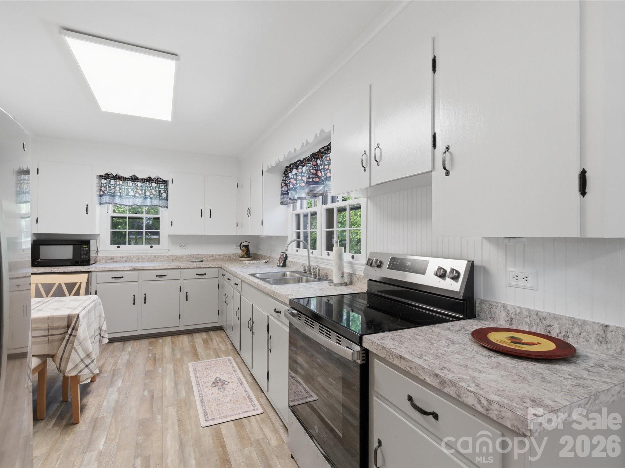 419 Knox Street Clover, SC 29710 - Photo 20 of 48 a kitchen with a stove a sink and a refrigerator