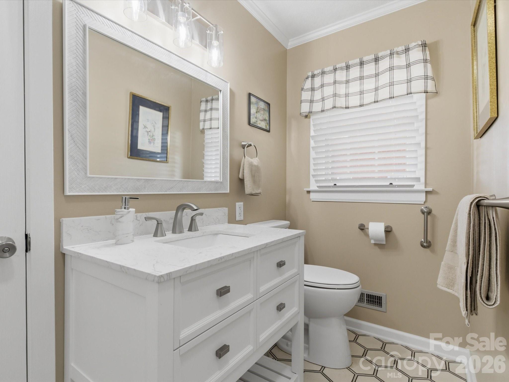 419 Knox Street Clover, SC 29710 - Photo 30 of 48 a bathroom with a sink a toilet and a mirror