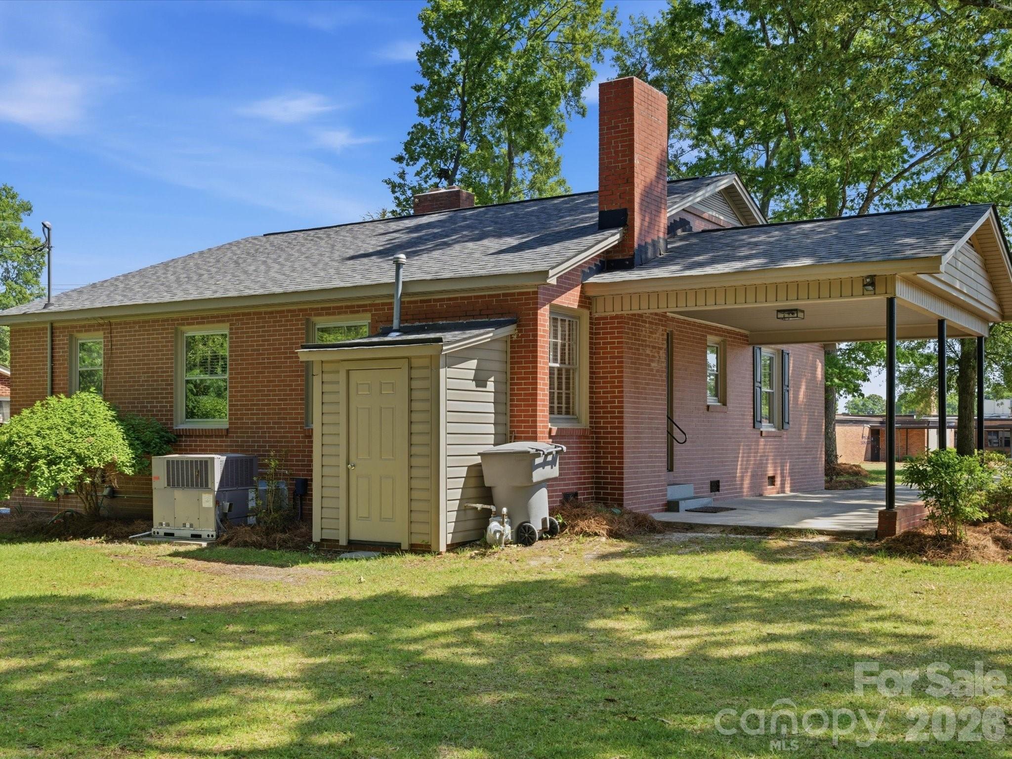 419 Knox Street Clover, SC 29710 - Photo 36 of 48 a front view of a house with garden