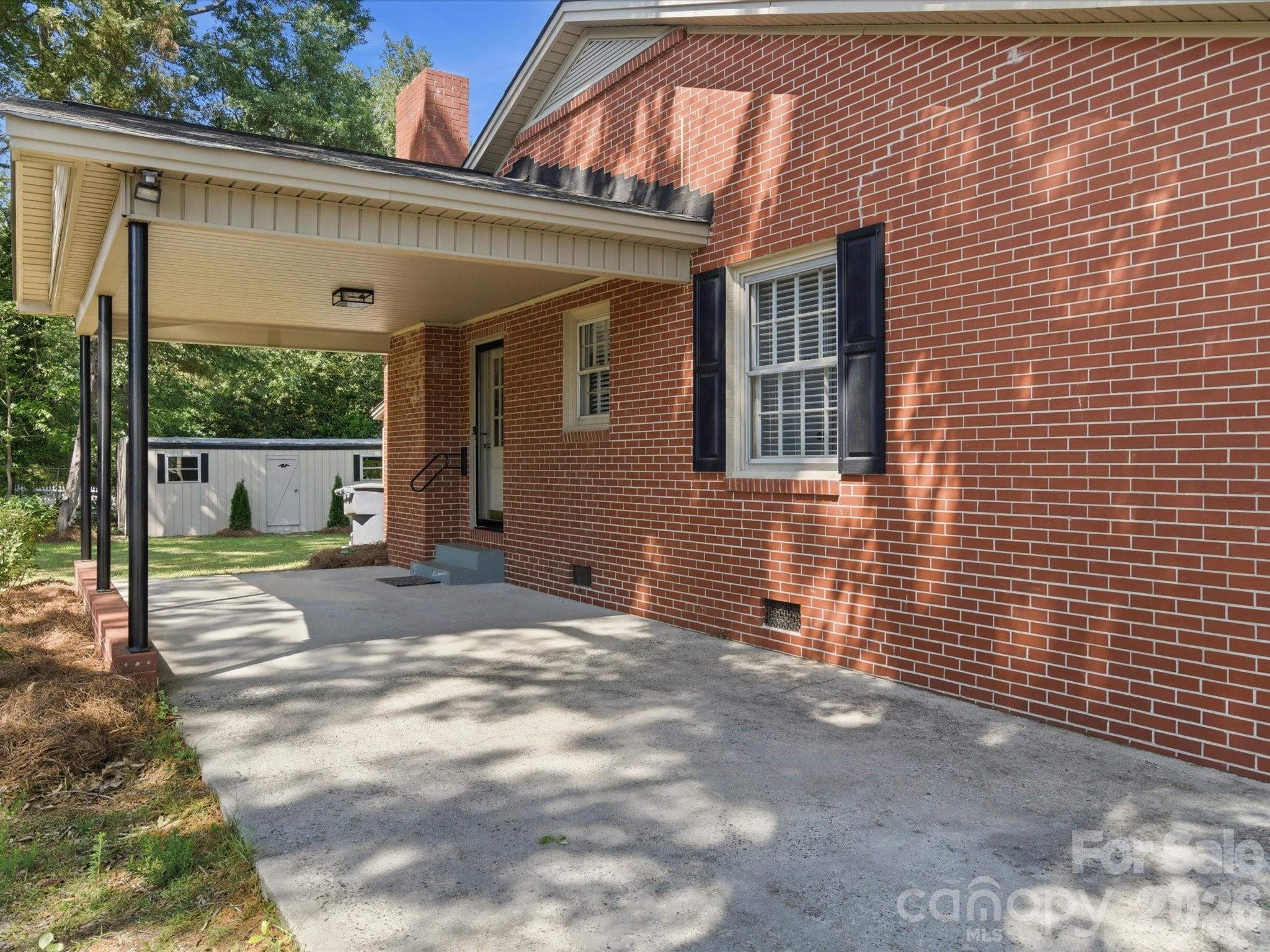 419 Knox Street Clover, SC 29710 - Photo 43 of 48 a view of a house with backyard and a patio