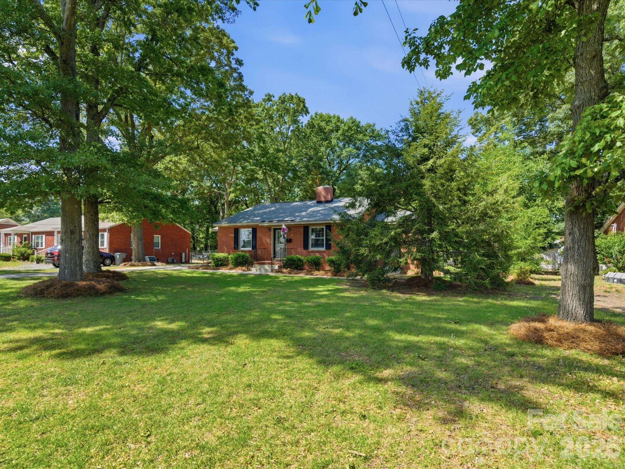 419 Knox Street Clover, SC 29710 - Photo 44 of 48 a front view of a house with garden