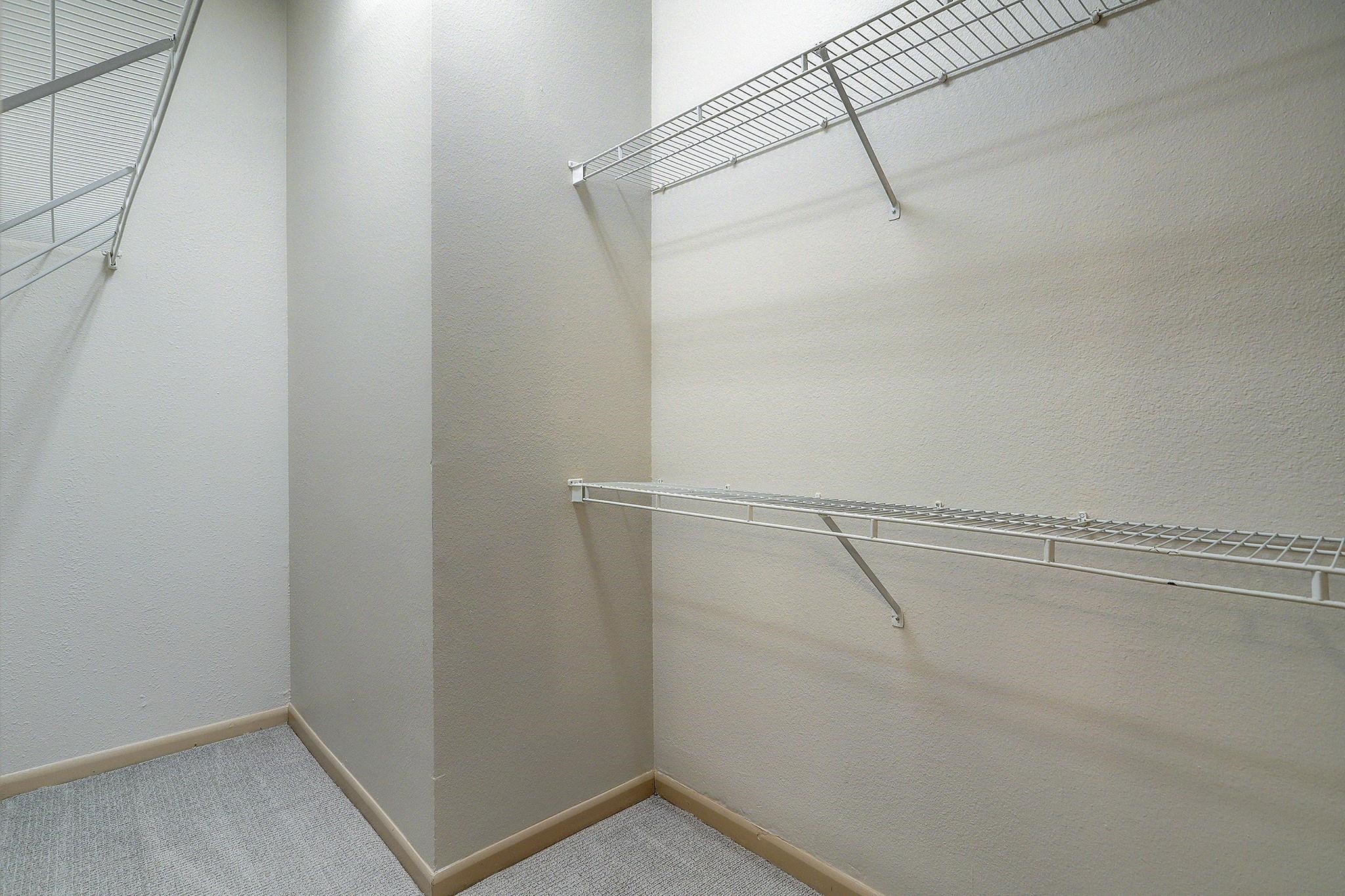 3505 Sage Road, Unit 207 Houston, TX 77056 - Photo 13 of 21 A large walk in closet is located just through the bathroom.