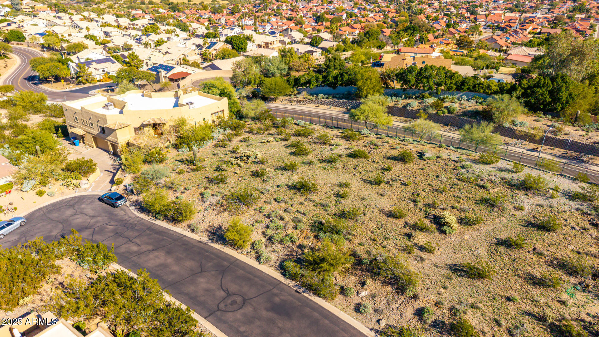 13821 16th Way, Unit 9 Phoenix, AZ 85022 - Photo 1 of 18 a view of a yard with plants and wooden fence