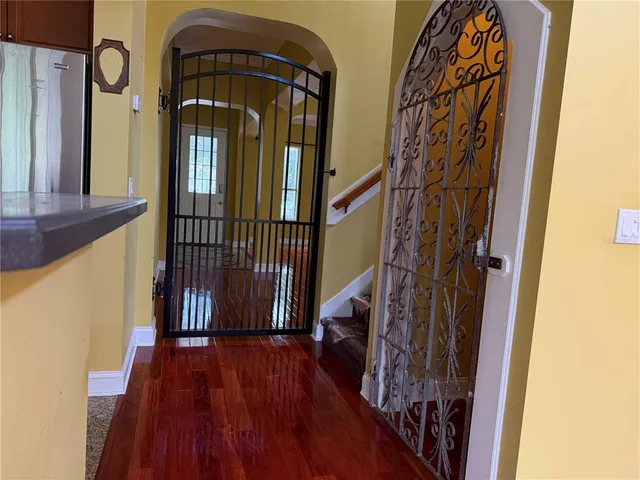 a view of a entryway door with wooden floor