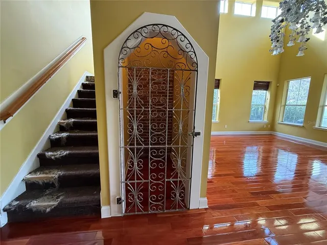 a view of a entryway door with wooden floor