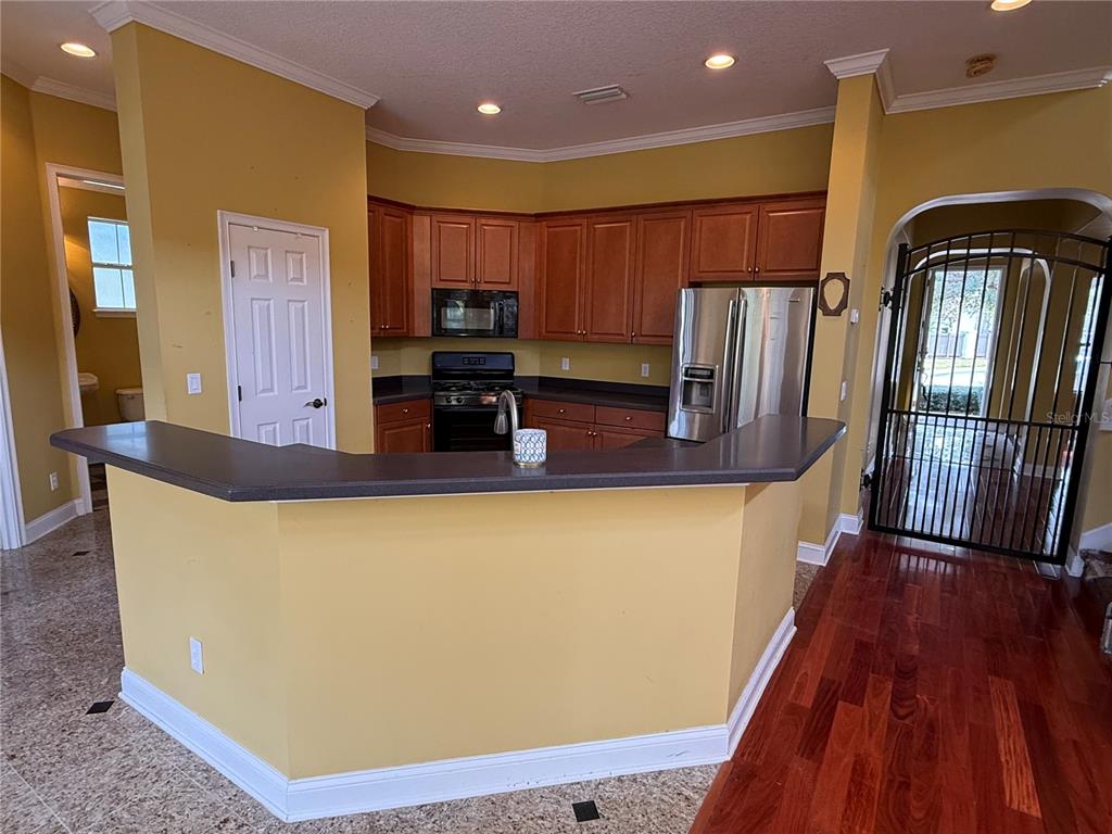 800 North End Street St. Augustine, FL 32095 - Photo 20 of 52 a kitchen with stainless steel appliances granite countertop a refrigerator a stove top oven and sink