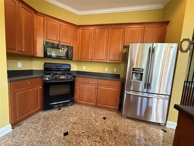 a kitchen with a sink and a mirror