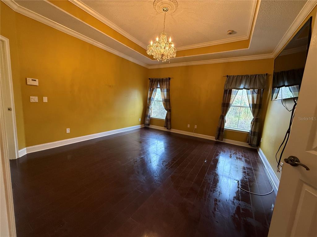 800 North End Street St. Augustine, FL 32095 - Photo 30 of 52 a view of an empty room with wooden floor and a window