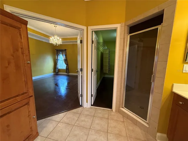 a bathroom with a tub sink and mirror