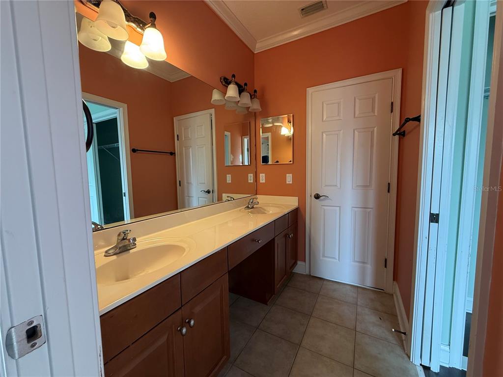800 North End Street St. Augustine, FL 32095 - Photo 42 of 52 a bathroom with a double vanity sink mirror and double