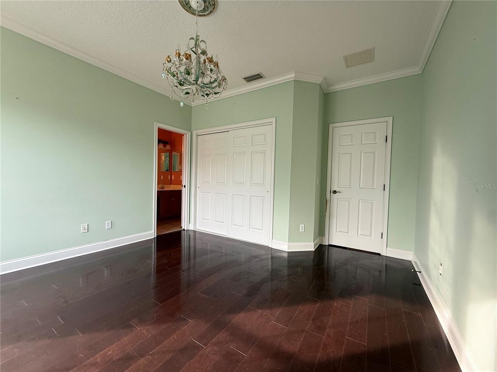 800 North End Street St. Augustine, FL 32095 - Photo 45 of 52 wooden floor in an empty room with a window