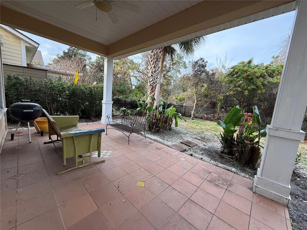 800 North End Street St. Augustine, FL 32095 - Photo 47 of 52 a view of a patio with table and chairs potted plants with floor to ceiling window and potted plants