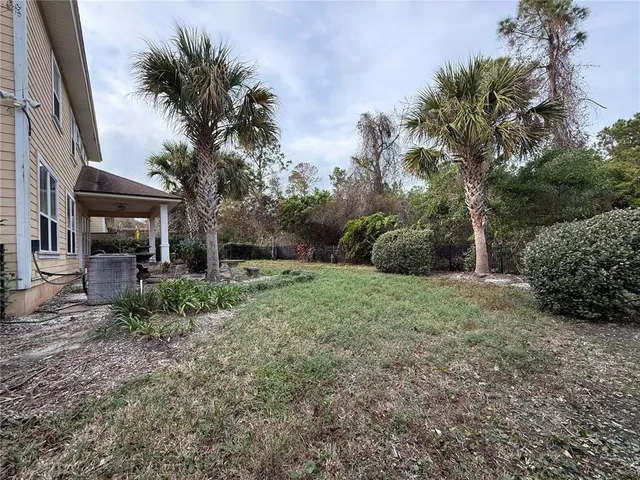 a view of a garage with wooden floor