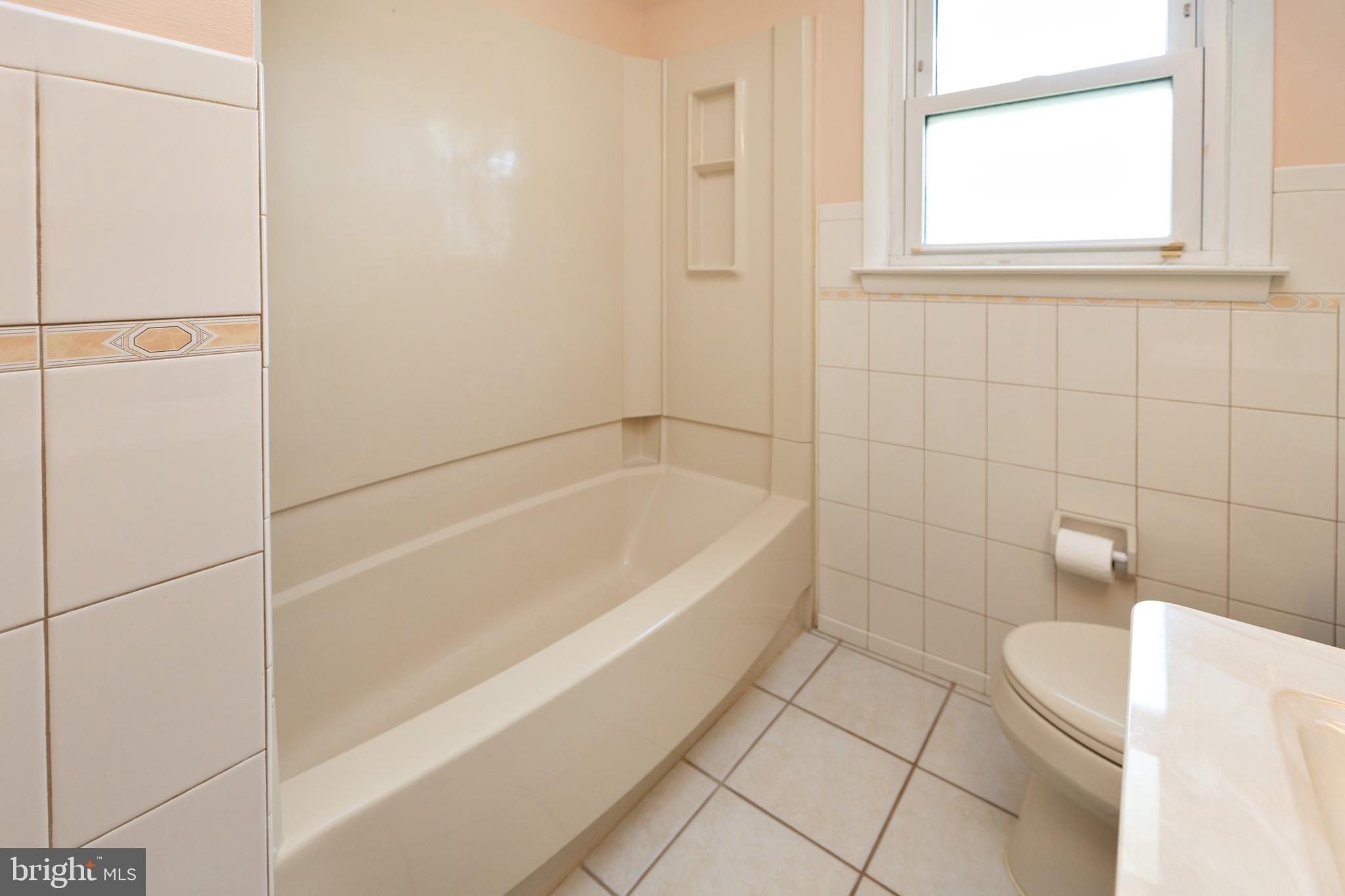 503 Pasadena Drive Magnolia, NJ 08049 - Photo 24 of 43 a bathroom with a bathtub and a shower