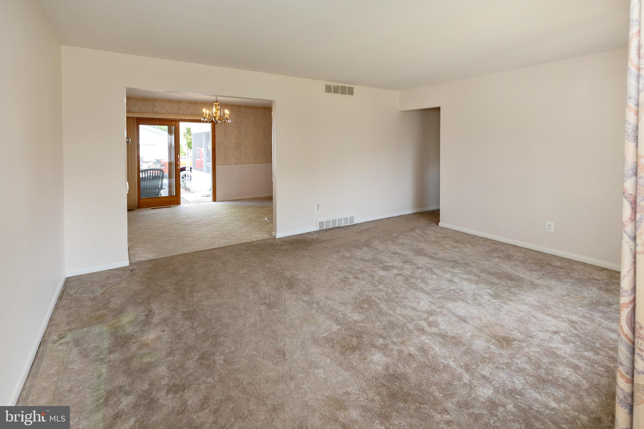 503 Pasadena Drive Magnolia, NJ 08049 - Photo 6 of 43 a view of an empty room with window
